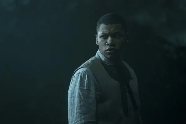 A young man looking over his shoulder.