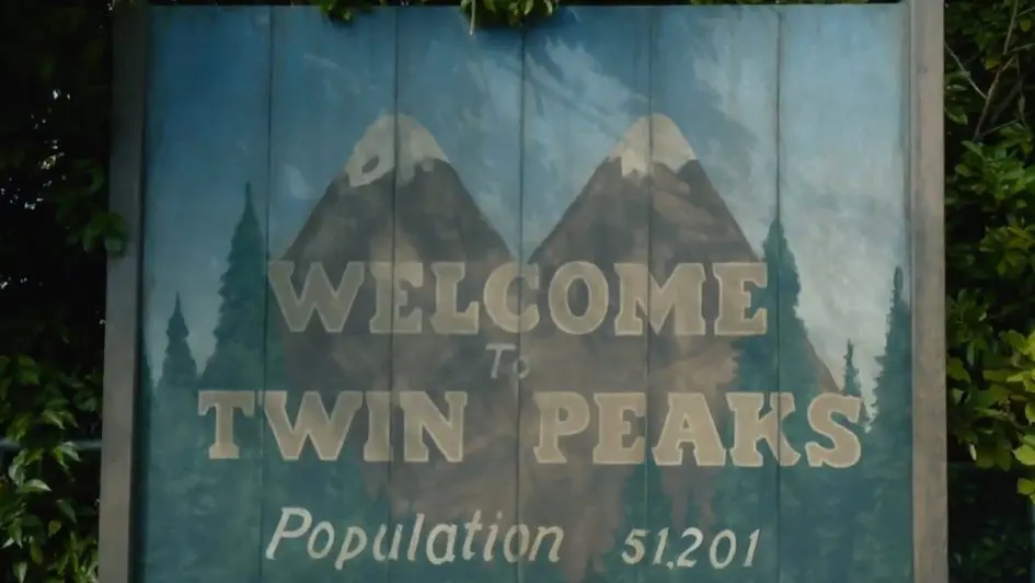 Welcome to Twin Peaks sign with mountains.