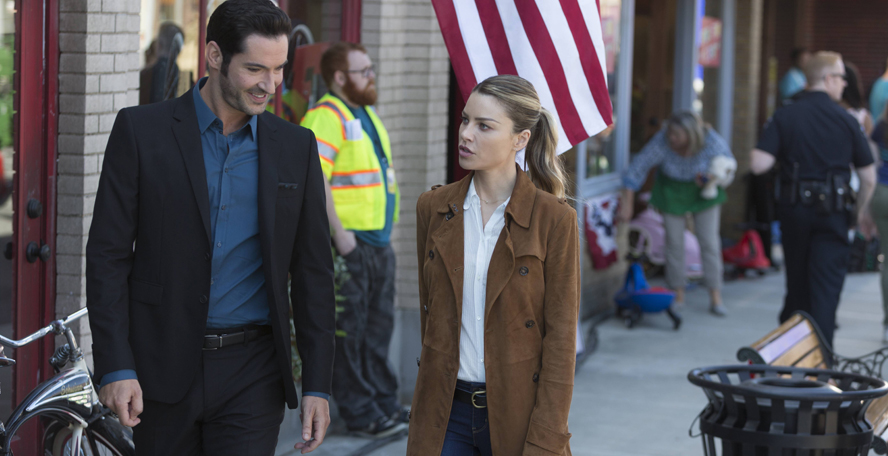 Lucifer and Chloe walking on a street.