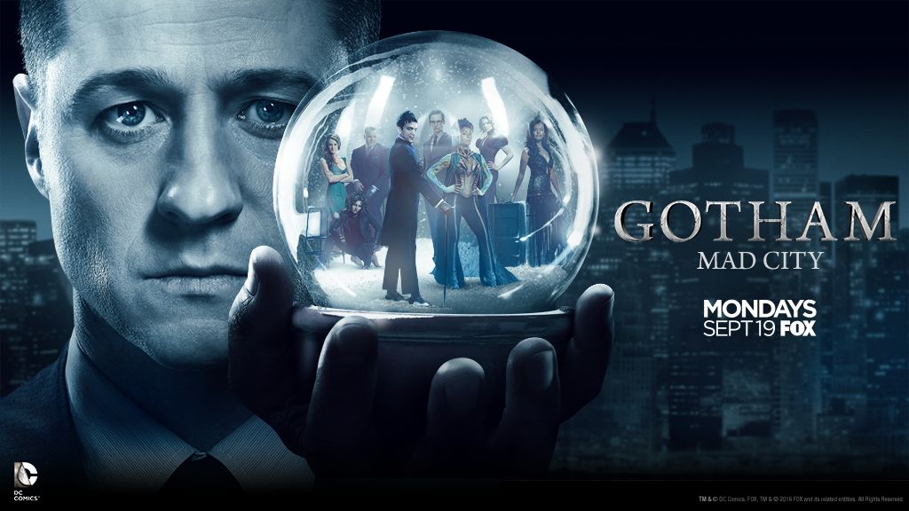 Gotham TV poster with snow globe.