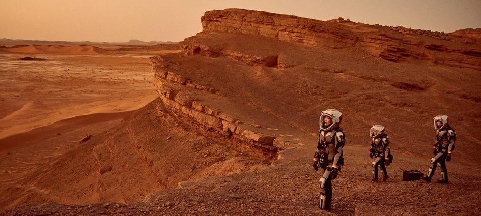 Three astronauts walking on Mars.