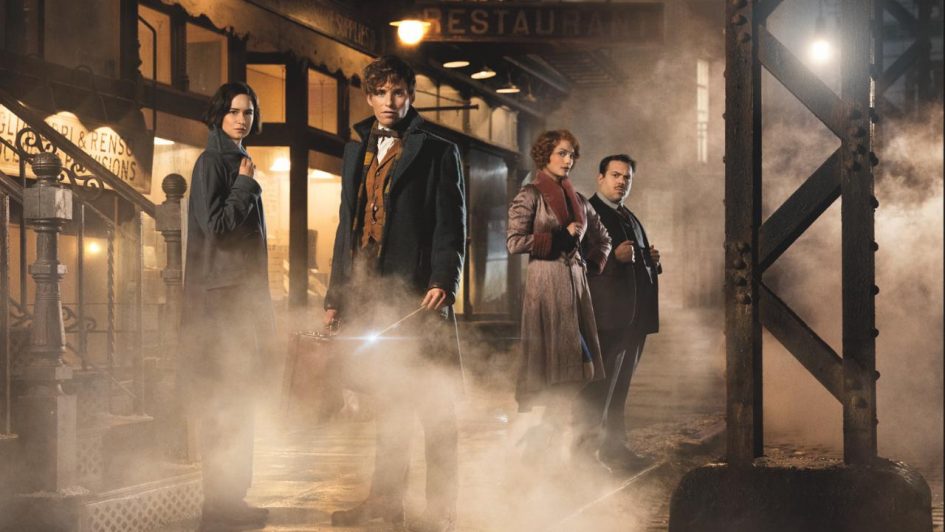 Fantastic Beasts cast in a foggy alleyway.