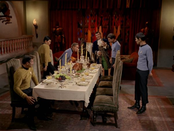 Star Trek crew at a formal dinner.