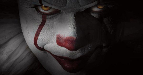 Close-up of Pennywise the clown's face.