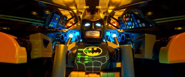 Lego Batman in his Batmobile cockpit.