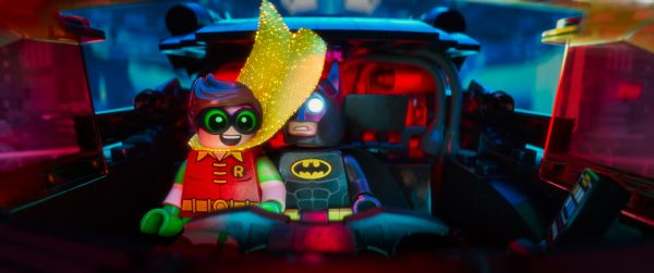 Lego Batman and Robin in a car.