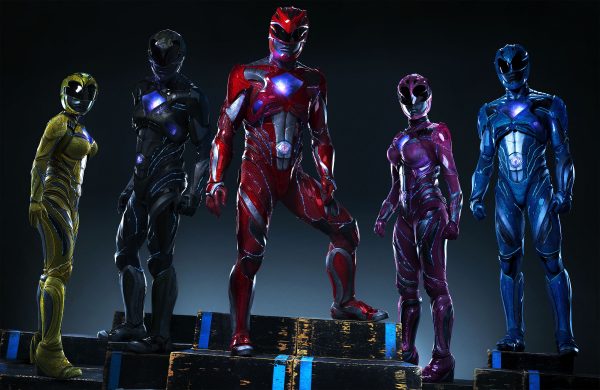 Power Rangers stand together, ready to fight.