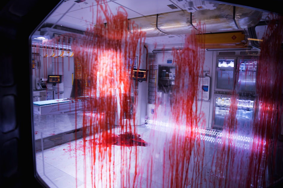 Blood splatters on a medical room floor.