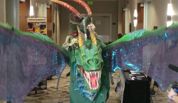 Person in dragon costume at a convention.