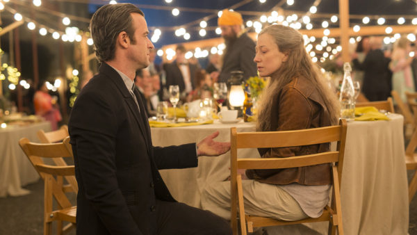 Man and woman sitting at a table.