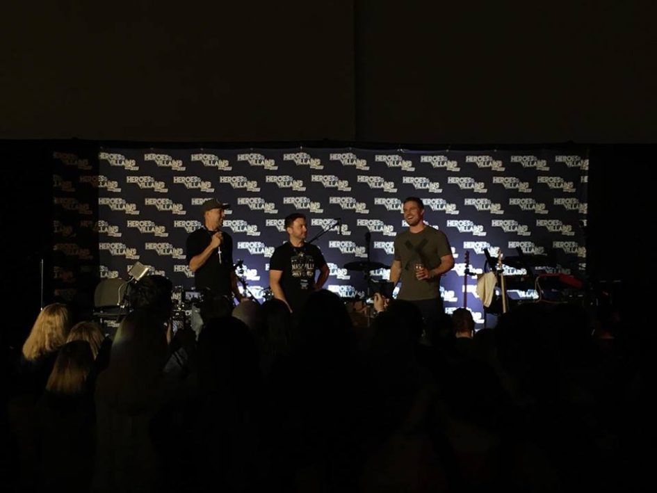 Three men on stage at Heroes & Villains Fan Fest.