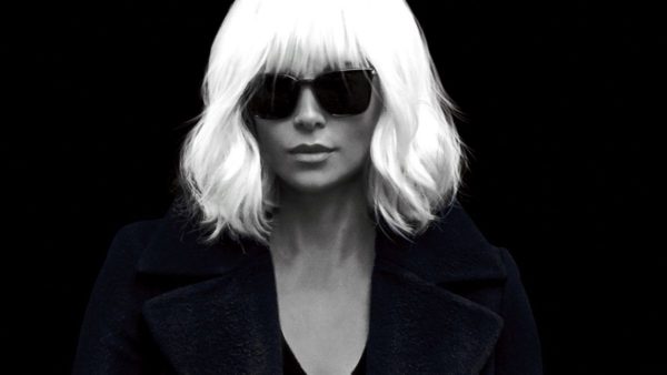 Woman with white hair and sunglasses.