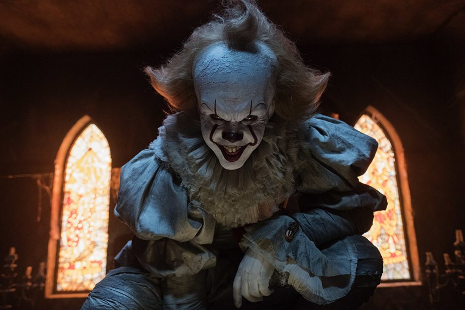 Pennywise the clown in a dark room.