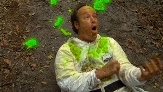 Man covered in green goo, surprised.