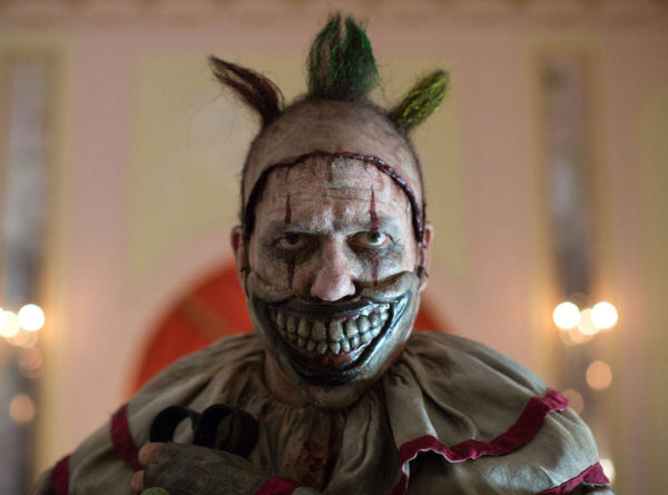 A creepy clown with a sinister smile.