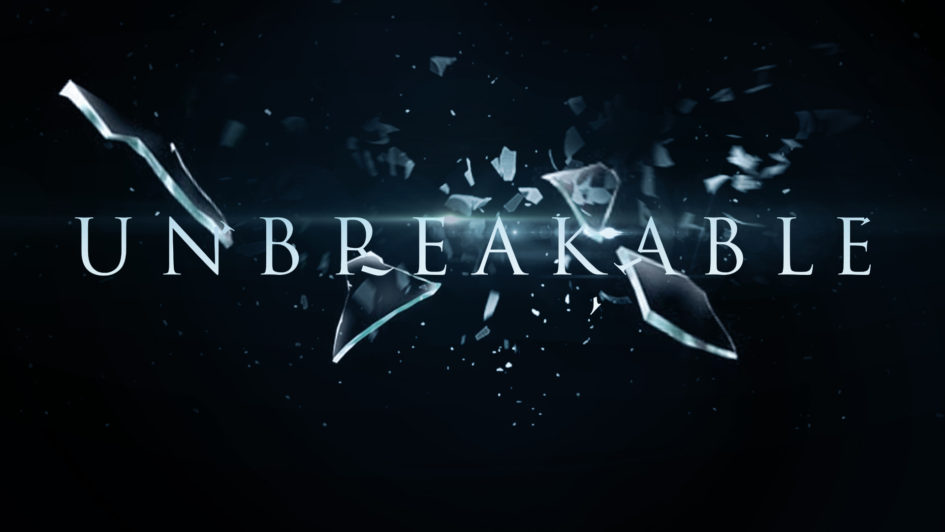 Shattered glass with "Unbreakable" text.