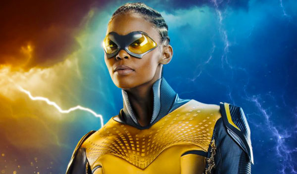 Black woman superhero in yellow suit.