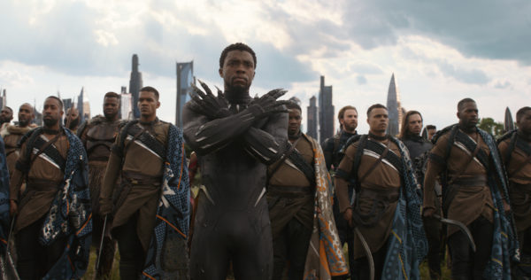 Black Panther and Wakandan warriors stand ready.