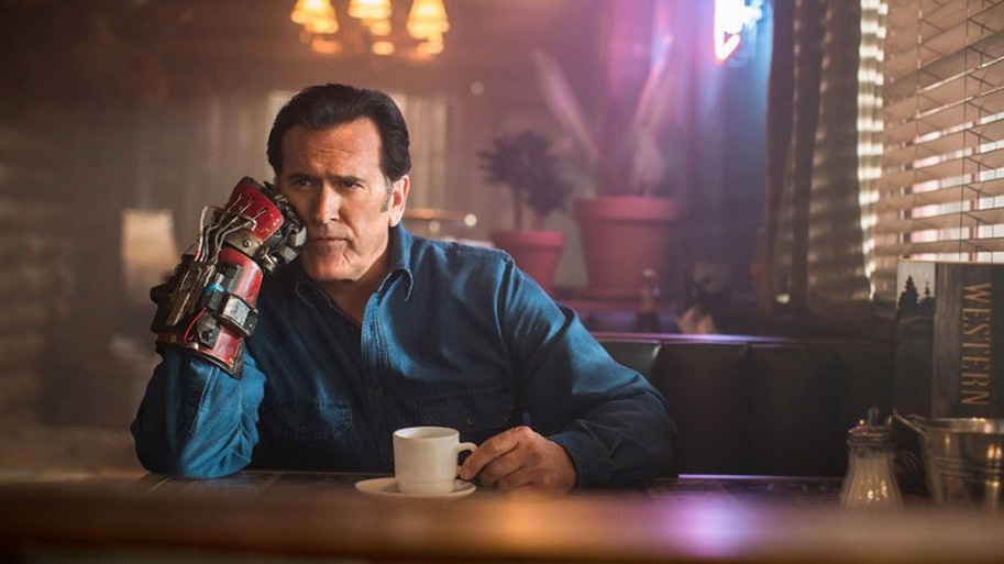 Man with a robotic arm in a diner.