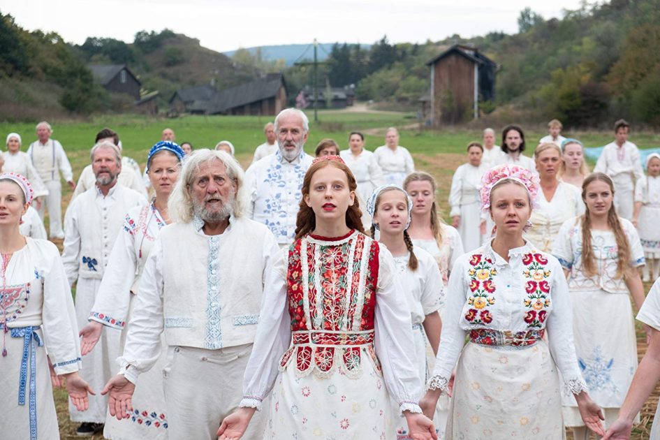 Group of people wearing white, festival clothing in the movie Midsommar