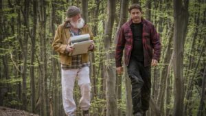 Nick Nolte and Gerard Butler walking in the forest