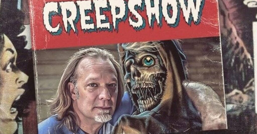 Greg Nicotero posing with the Creepshow mascot